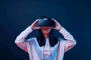 young woman uses VR goggles