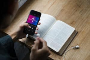 Christian man using church technology to worship